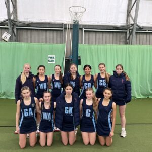 Smiling girls in netball outfits