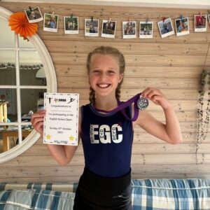 Daisy smiling with medals