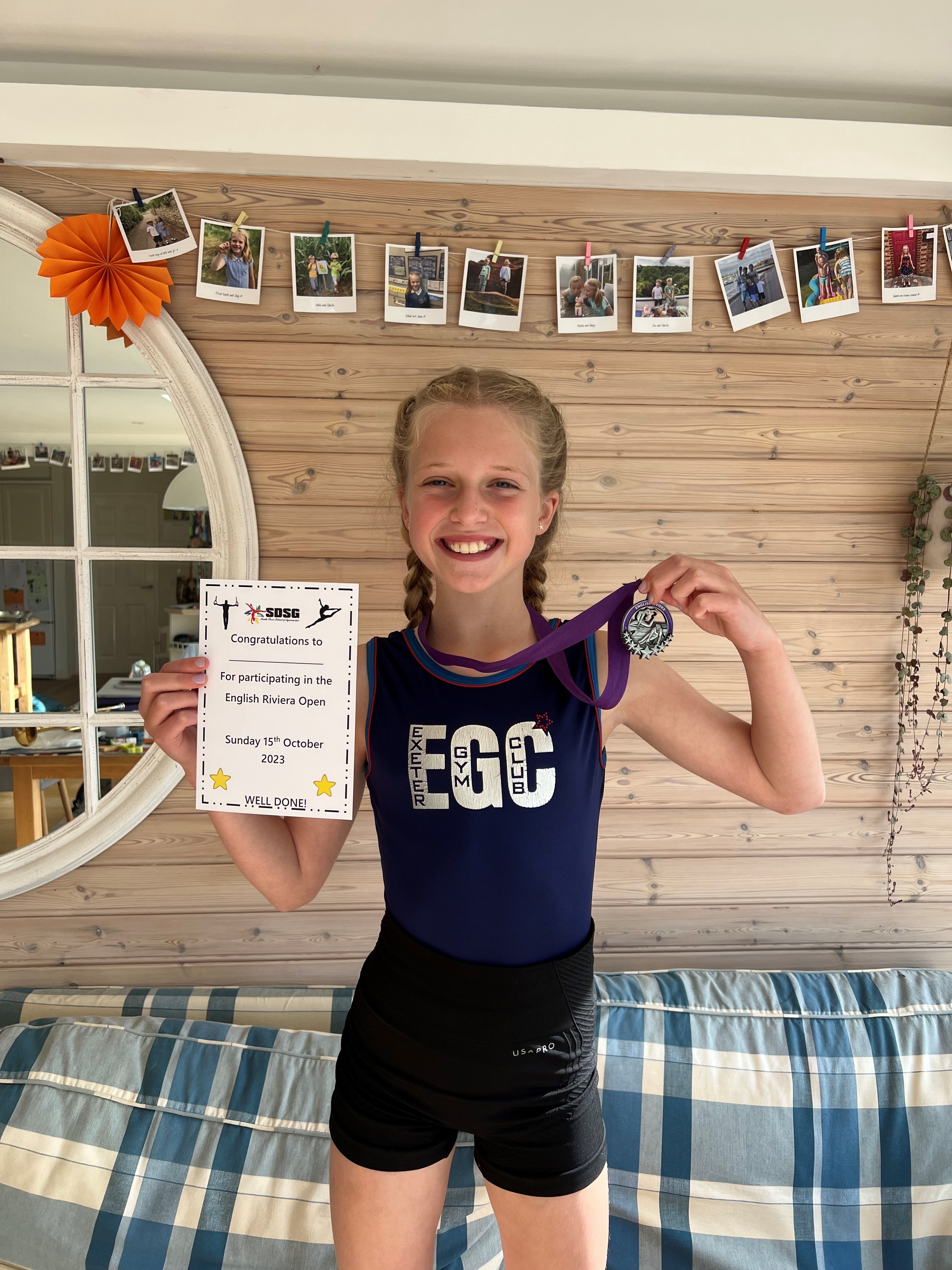 Daisy smiling with medals