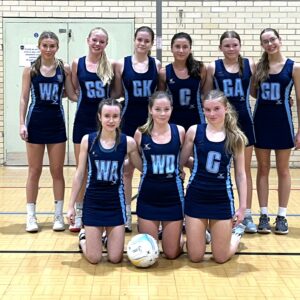 Netball team smiling