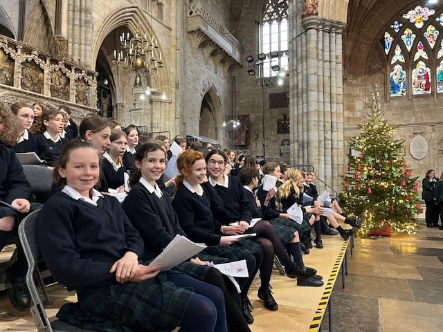 Girls smiling in Exeter Cathedral