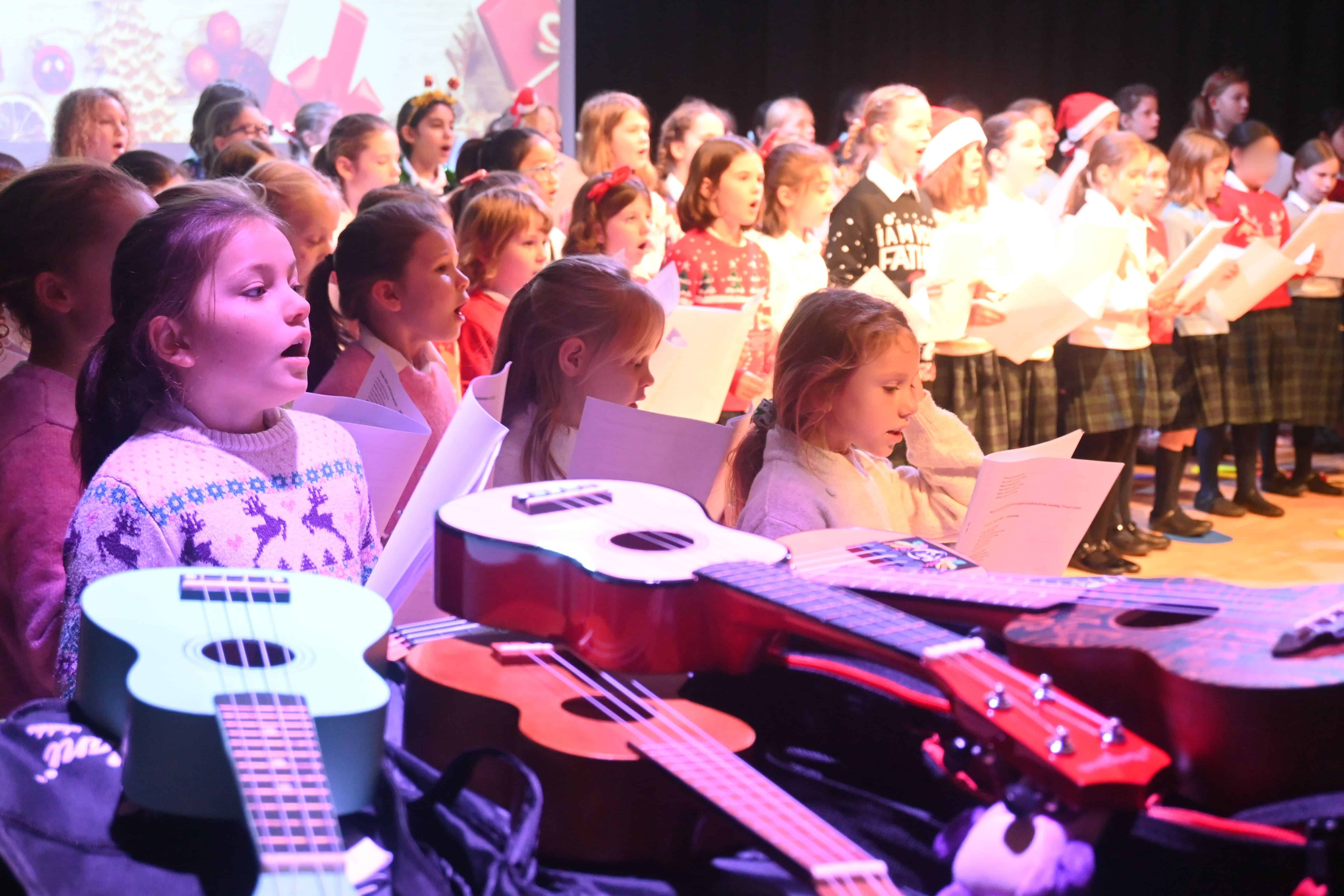 Ukeleles and girls singing