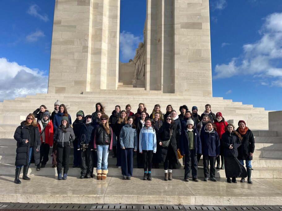 Girls standing in front of a World War I memorial - The Maynard School - www.maynard.co.uk
